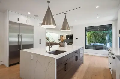 a kitchen with a sink and a large window at Curson Modern in Los Angeles