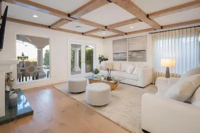 a living room with white furniture and a table at Stradella Spanish in Los Angeles