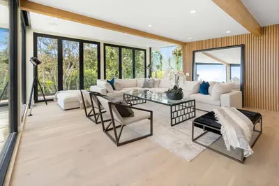 a living room with a white couch and a table at Sea Vista in Malibu