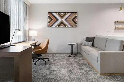 a living room with a couch and a desk at Residence Inn by Marriott Chatsworth in Chatsworth