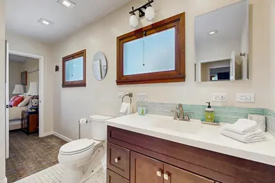 a bathroom with a white sink and a toilet at Cedar Oasis in Ventura
