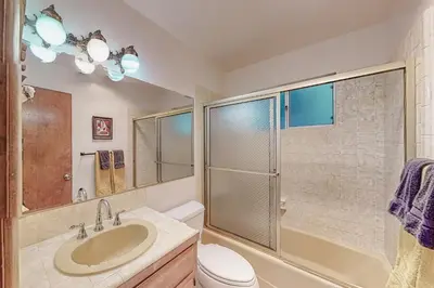 a bathroom with a sink toilet and a shower at Dragon's Lair in Lake Arrowhead