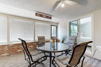 a dining room with a table and chairs at Evening Oasis in Orange