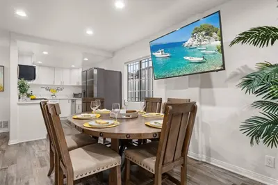 a kitchen and dining room with a table and chairs at The Avalon - 35 Percent Off March! in Los Angeles