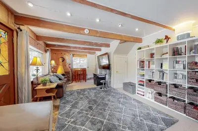 a living room with a couch and a table at Annandale Manor in Lake Arrowhead