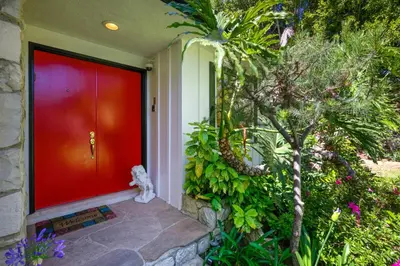 a red door on a house with a garden at Tullis Charm in Los Angeles