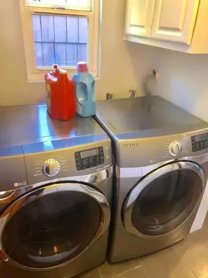 a washer and a washing machine in a kitchen at Endless summer in LA *HEATED POOL/HOT TUB/CABANA* in Los Angeles