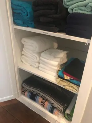 a closet filled with folded towels and towels at Endless summer in LA *HEATED POOL/HOT TUB/CABANA* in Los Angeles