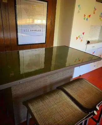 a glass counter with a chair in a room at Endless summer in LA *HEATED POOL/HOT TUB/CABANA* in Los Angeles