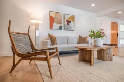 a living room with a couch and a chair and a table at #Marbella Lane - Cozy Modern Home with Relaxing Design & Pool in Fullerton
