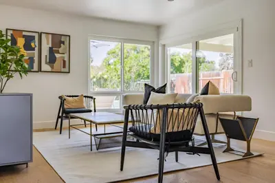 a living room with a couch and a table at #Marbella Lane - Cozy Modern Home with Relaxing Design & Pool in Fullerton