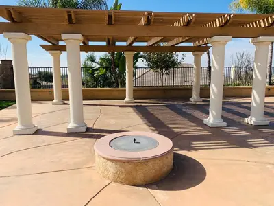a stone bowl in the middle of a pergola at HighEnd Rooms in Mansion in Riverside