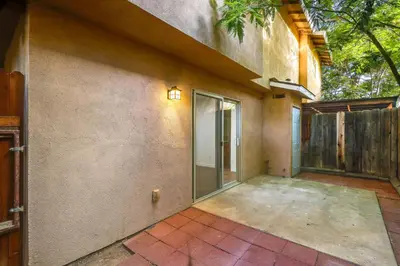 an empty patio of a house with a sliding glass door at Convenient Bakersfield Townhome with Patio! in Bakersfield