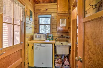 a small kitchen with a sink and a microwave at Big Bear Lake Cabin about 4 Mi Snow Summit Ski Resort in Big Bear Lake