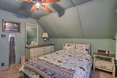 a bedroom with a bed and a ceiling fan at Big Bear Lake Cabin about 4 Mi Snow Summit Ski Resort in Big Bear Lake