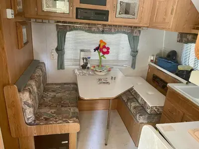 a small kitchen with a table in a tiny house at Glamping property in Panorama Heights