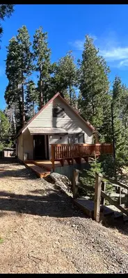 a small house with a fence in front of it at Sequoia National Forest Cabin-ATV Ride in Panorama Heights