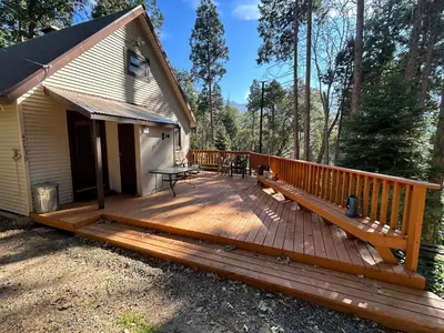 a large wooden deck in front of a house at Sequoia National Forest Cabin-ATV Ride in Panorama Heights
