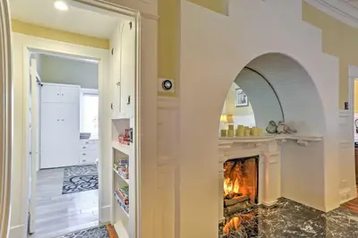 an archway in a kitchen with a fireplace at Carpinteria Apt with Hot Tub - 10 Min Walk to Beach! in Carpinteria