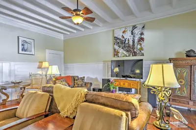 a living room with a couch and a tv at Carpinteria Apt with Hot Tub - 10 Min Walk to Beach! in Carpinteria