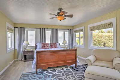 a bedroom with a bed and a ceiling fan at Carpinteria Apt with Hot Tub - 10 Min Walk to Beach! in Carpinteria