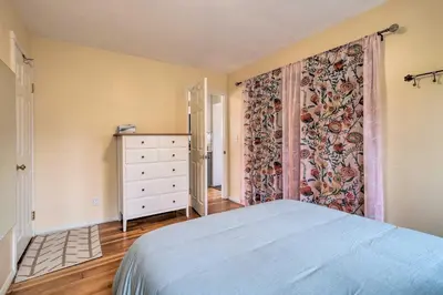 a bedroom with a bed and a large curtain at Charming Santa Paula Home - Walk to Downtown! in Santa Paula