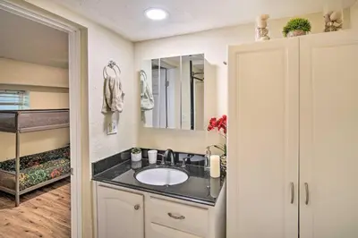 a bathroom with a sink and a mirror at Cozy Crestline Getaway about 2 Mi to Lake Gregory in Crestline