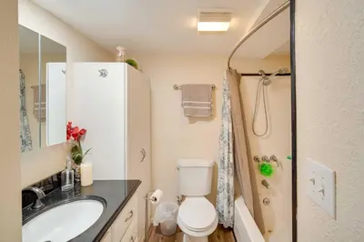 a bathroom with a toilet and a sink and a shower at Cozy Crestline Getaway about 2 Mi to Lake Gregory in Crestline