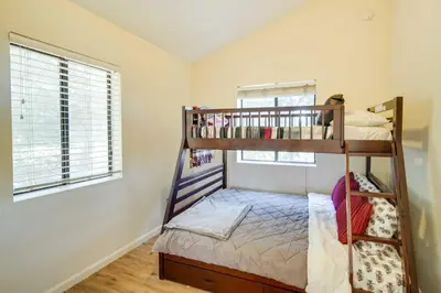 a bedroom with two bunk beds and a window at All-Season Crestline Escape - 2 Mi to Lake! in Crestline