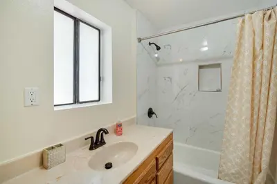 a bathroom with a sink and a shower at All-Season Crestline Escape - 2 Mi to Lake! in Crestline