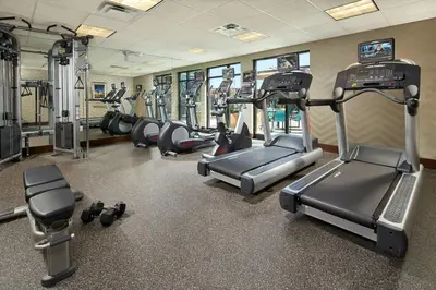 a gym with several treadmills and cardio machines at Residence Inn by Marriott Los Angeles Redondo Beach in Redondo Beach