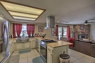 a kitchen with a sink and a stove top oven at Spacious Lancaster Family Ranch - BBQ and Patio in Lancaster