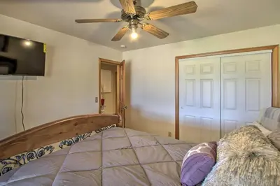 a bedroom with a ceiling fan and a bed at Spacious Lancaster Family Ranch - BBQ and Patio in Lancaster