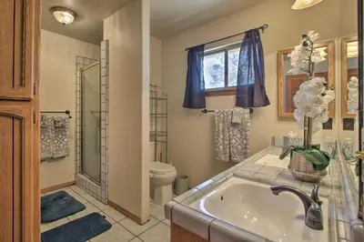 a bathroom with a tub and a toilet and a sink at Spacious Lancaster Family Ranch - BBQ and Patio in Lancaster