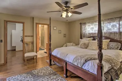 a bedroom with a bed and a ceiling fan at Spacious Lancaster Family Ranch - BBQ and Patio in Lancaster