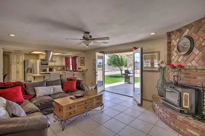 a living room with a couch and a fireplace at Spacious Lancaster Family Ranch - BBQ and Patio in Lancaster