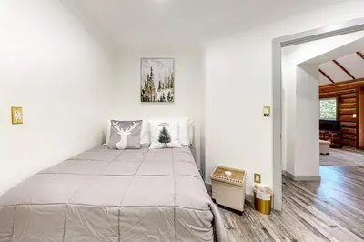 a bedroom with a large bed in a room at Top Town Retreat in Crestline