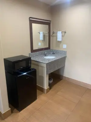 a bathroom with a sink and a mirror at Stardust inn in Azusa