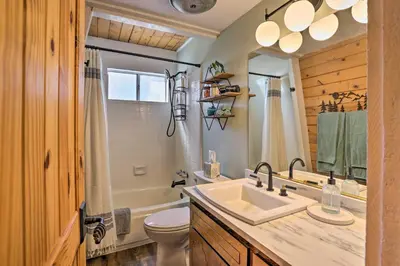 a bathroom with a sink and a tub and a toilet at Pet-Friendly Cottage, Walk From Big Bear Village! in Big Bear Lake
