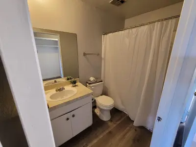 a bathroom with a sink and a toilet and a mirror at (B27) Cozy & Serene Private LA Studio in Los Angeles