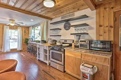a kitchen with a stove and a counter top at Big Bear Cabin Close to Lake, Trails and Village! in Big Bear Lake