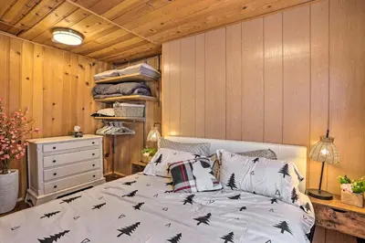 a bedroom with a bed with black bats on it at Big Bear Cabin Close to Lake, Trails and Village! in Big Bear Lake