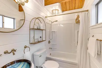 a bathroom with a toilet and a shower and a sink at Snow Valley Hideaway Arrowbear Lake Retreat in Arrowbear Lake