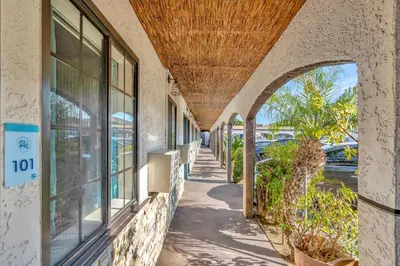 a hallway of a building with a roof at Royal Hawaiian Inn - Mid City, Los Angeles in Los Angeles