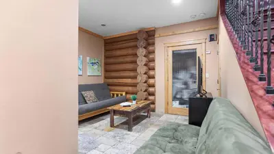 a living room with a couch and a table at 0.5mi to the Lake Deck w Views Poker Table Eagle Ridge Retreat by AvantStay in Big Bear Lake