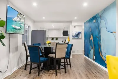 a kitchen and dining room with a table and chairs at The Avalon - 35 Percent Off March! in Los Angeles