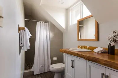 a bathroom with a sink and a toilet at Walk to the Lake Sand Volleyball Court Pool Table Deck Gambler by AvantStay in Big Bear Lake