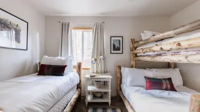 a bedroom with two beds and a window at Jackhorn by AvantStay Close to Big Bear Marina and Village Hot Tub Foosball in Big Bear Lake