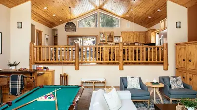 a living room with a pool table at Bernard by AvantStay Luxurious Cabin in Big Bear w Hot Tub Pool Table in Big Bear Lake