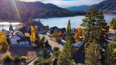 an aerial view of a town with a lake at 50 yards to Lake Boulder Bay • Pool Table Lakeside in Bearadise by AvantStay in Big Bear Lake